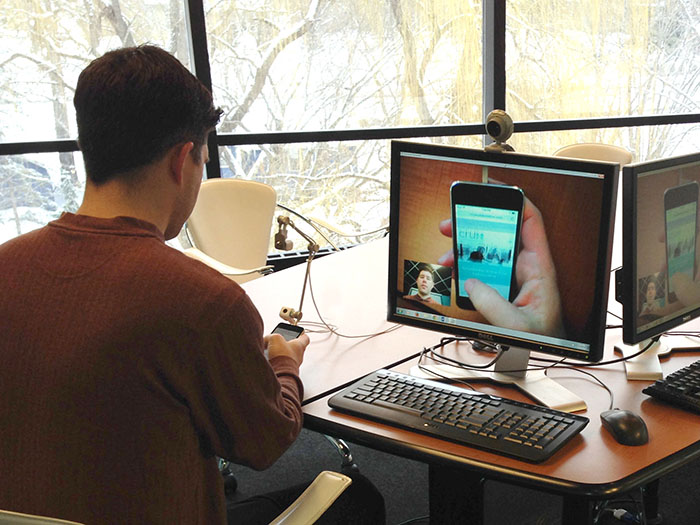 photo of man participating in a mobile device usability test
